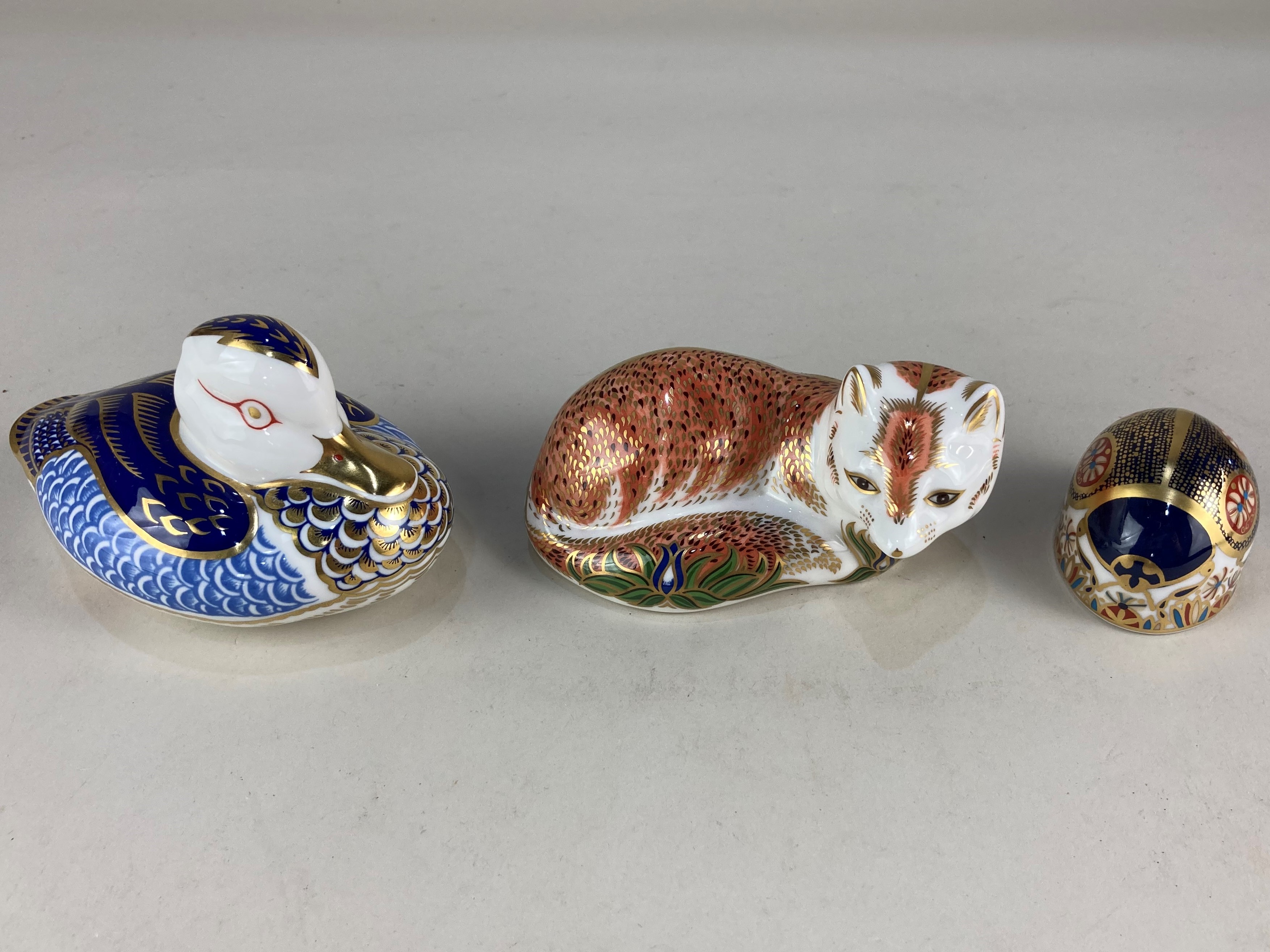 A collection of three Royal Crown Derby porcelain paperweights, comprising The Leicestershire Fox,