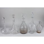 A collection of five various cut glass wine and spirit decanters, tallest 32.5cm high