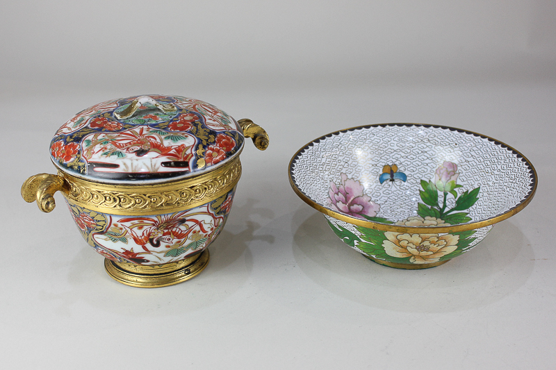 A gilt metal mounted two handled porcelain circular pot and cover, decorated in the Imari palette