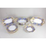 A Spode Felspar porcelain part dessert service, decorated in gilt on a band of blue ground with