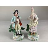 A pair of Derby porcelain figures of musicians, the lady playing a triangle, the gentleman a drum