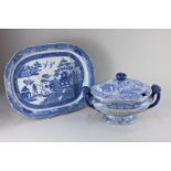 A large 'semi china' blue and white transfer printed oval tureen and cover, 30cm high, together with