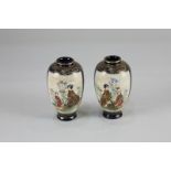 A pair of miniature Japanese Satsuma ware vases, decorated with panels of figures in a garden, on
