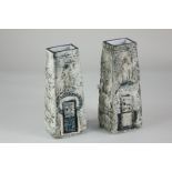 A pair of Troika pottery 'coffin' vases, with textured blue abstract decoration on mottled ground,