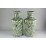 A pair of Chinese porcelain vases, of slender quatre-lobed form, decorated in blue with dragons