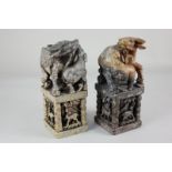 A pair of Chinese carved hardstone seals, each with a buffalo and calf on plinths with animals