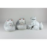 A pair of Japanese porcelain models of white cats, possibly incense burners, marks to base, 17cm