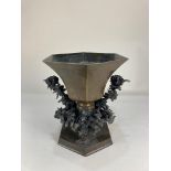 A Japanese bronze table centrepiece, the hexagonal vase inlaid with designs of butterflies and