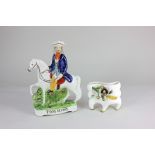 A Staffordshire pottery flat back figure of Tom King together with a pottery vase with bocage floral