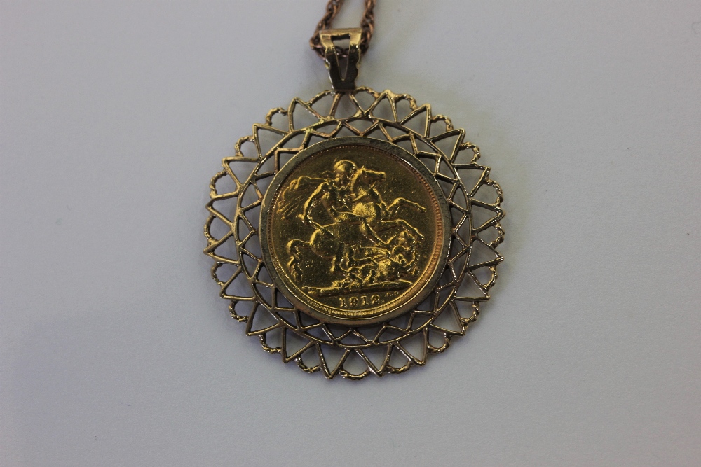 A 1912 sovereign in a 9ct gold pendant mount on a rope twist chain, (a/f chain broken) 15.8g gross - Image 2 of 2