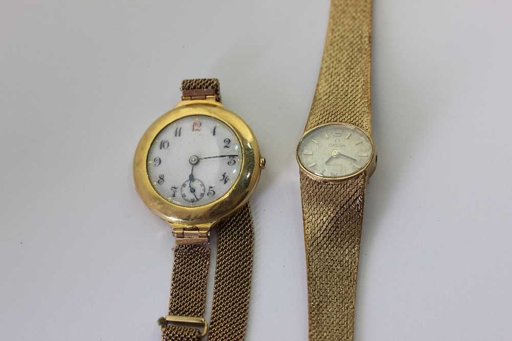 A lady's 9ct gold bracelet watch by Omega; a lady's 18ct gold watch on a 9ct gold bracelet