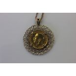 A 1912 sovereign in a 9ct gold pendant mount on a rope twist chain, (a/f chain broken) 15.8g gross