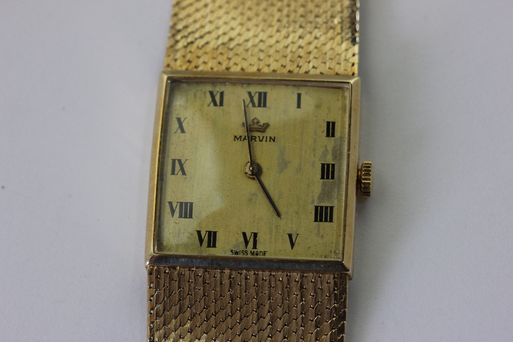 A gentleman's 9ct gold bracelet watch by Marvin 45g weighable