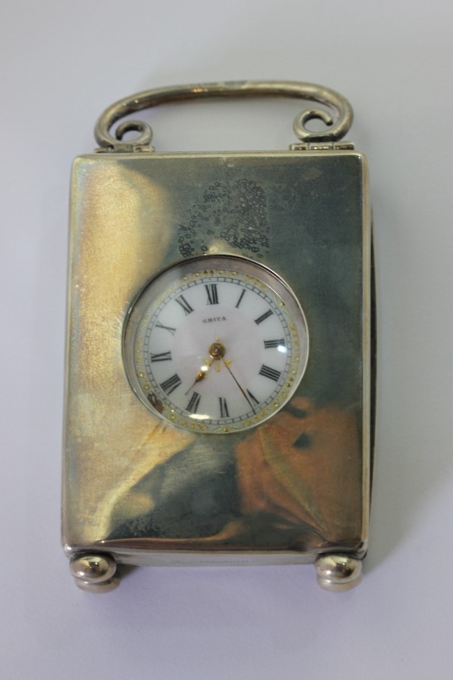 A lady's Swiss silver open face pocket watch circa 1900 in a silver travelling case, hallmarked