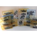 A collection of plastic model fighter jets and warships, most DeAgostini, to include a U.S Air Force
