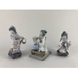 A pair of Lladro porcelain figures of Japanese geishas kneeling and holding flowers, together with a