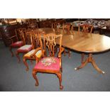 A set of eight mahogany Chippendale style dining chairs with carved and pierced backs, with tapestry