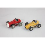 A Schuco clockwork Micro Racer in red, model 1041 and another in yellow, model 1040, (a/f some paint
