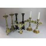 Three pairs of candlesticks, to include a pair of brass candlesticks, the stems formed as two
