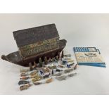A painted wood toy Noah's Ark with sliding side panel containing various wooden animals, (
