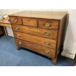 A 19th century mahogany flat front chest of three short over three long drawers, with brass oval