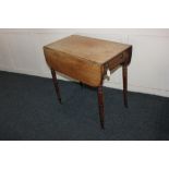 An early 19th century mahogany Pembroke table with drawer to one end, on turned legs, 70cm