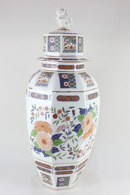 A large Oriental porcelain jar and cover, of hexagonal baluster form, with floral decoration in