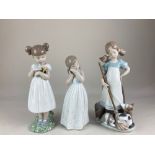 Three Lladro porcelain figures of girls, 'Playful Kittens' ''Flowers for Mommy' and 'My Sweet
