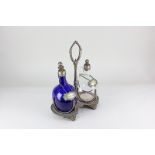 A plated decanter stand inset with two glass decanters, of flattened globular form, in blue and