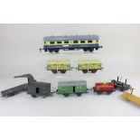 A collection of Hornby O gauge model railway wagons and coaches, comprising two Hornby cattle