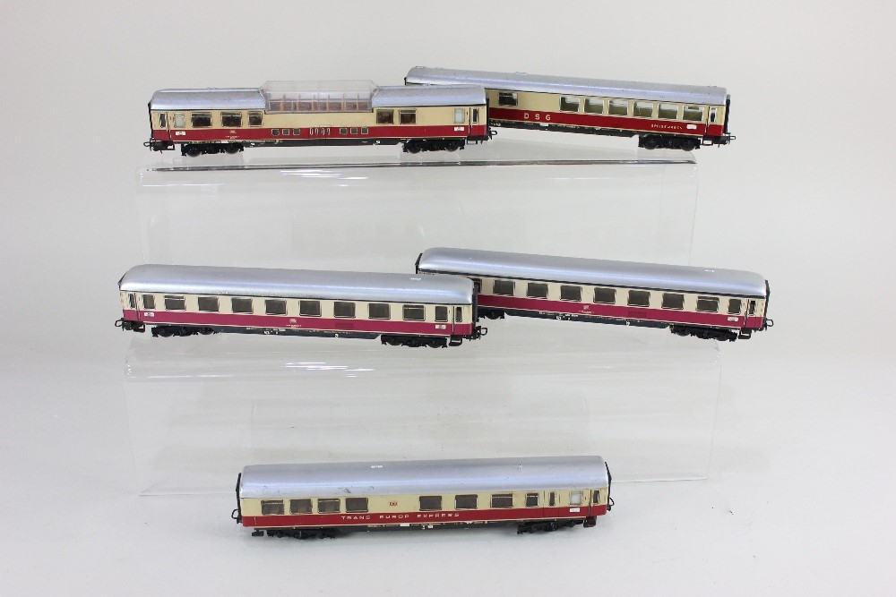 A collection of five Marklin HO gauge Trans Europ Express model railway coaches, with cream and