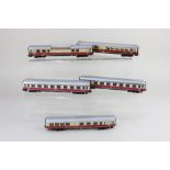 A collection of five Marklin HO gauge Trans Europ Express model railway coaches, with cream and