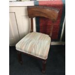 A William IV carved mahogany single dining chair curved back with scroll carved top edge, stripe