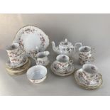 A Duchess 'June Bouquet' porcelain tea set, decorated with pink and white roses on white ground,