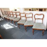 A matched set of seven (five and two) Victorian mahogany balloon back dining chairs, on turned legs,