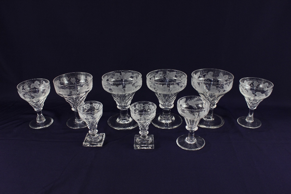 A part set of glassware with acid etched vine leaf decoration, some marked Walsh England, comprising