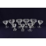 A part set of glassware with acid etched vine leaf decoration, some marked Walsh England, comprising