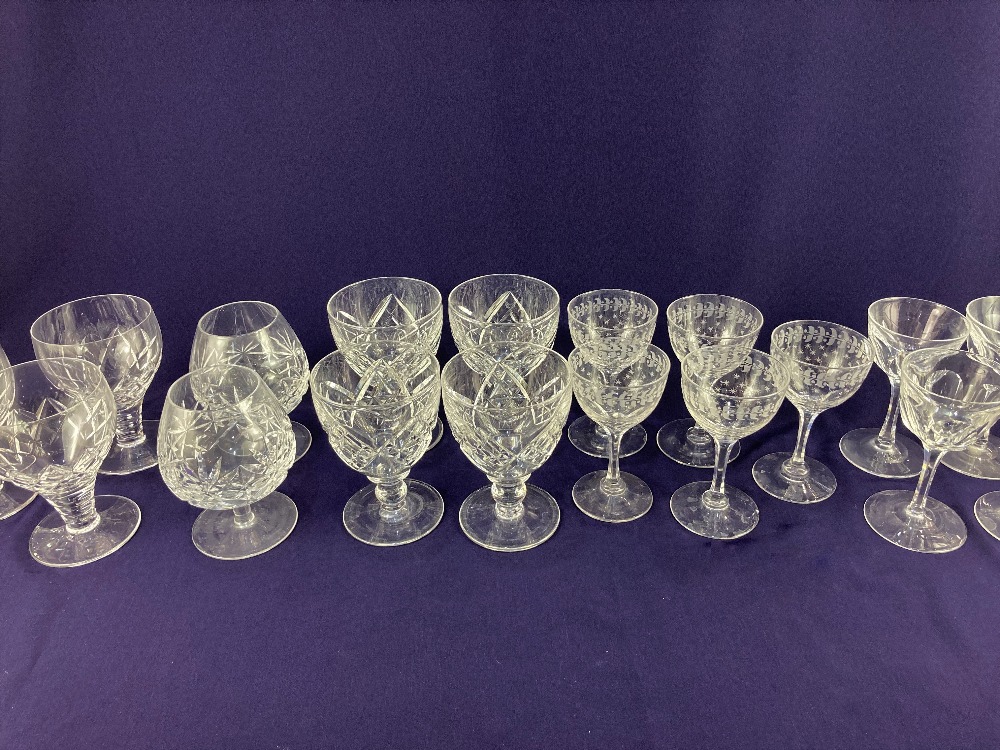 A set of four cut glass rummers, a set of three similar rummers, a pair of brandy glasses, a set