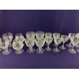 A set of four cut glass rummers, a set of three similar rummers, a pair of brandy glasses, a set