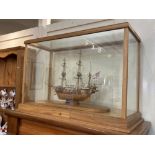 A model ship in glass case, H.M.S. Beagle, built by Richard Hebbourne, completed in 1998, with