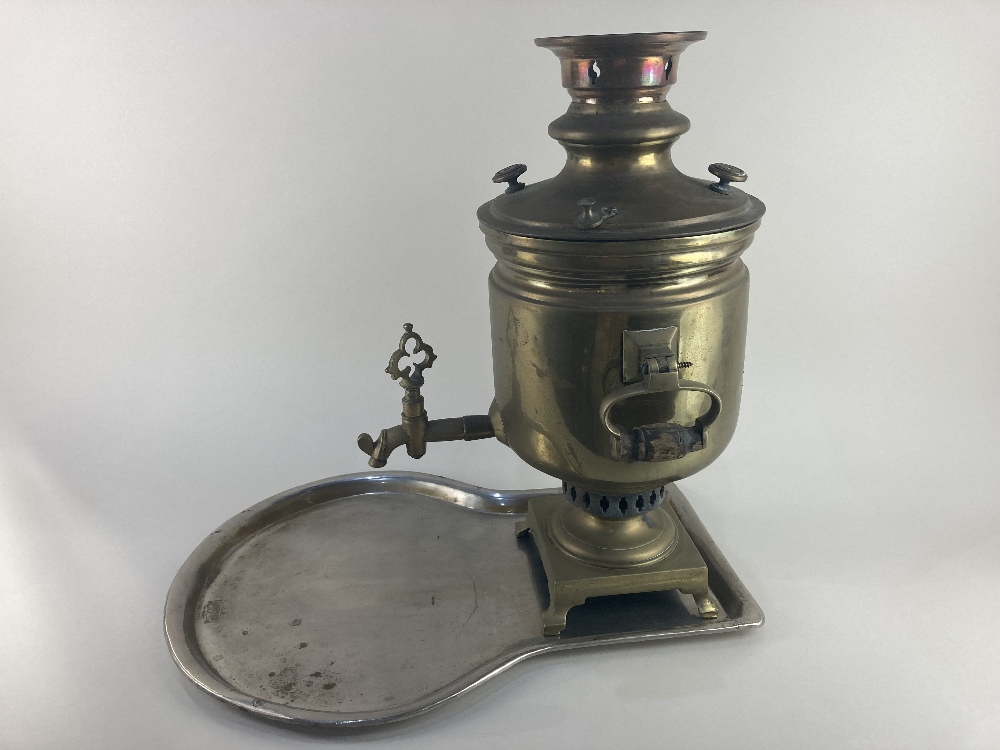 A Russian brass samovar, with Cyrillic makers stamp, on silver plated brass key tray (plating