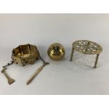An Indian brass octagonal dish with pincers and small shovel, on column supports (two detached) by