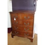 A small reproduction walnut bow front chest of four drawers, on bracket feet, 64cm