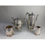 An Elkington & Co silver plated four piece tea set, of scalloped form, with scrolling floral