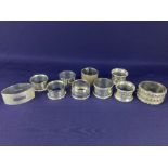 A pair of George V silver napkin rings, makers Sanders & Mackenzie, Birmingham 1926, another pair of