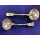 A pair of George III silver fiddle pattern sauce ladles, maker Paul Storr, London 1816, crested with