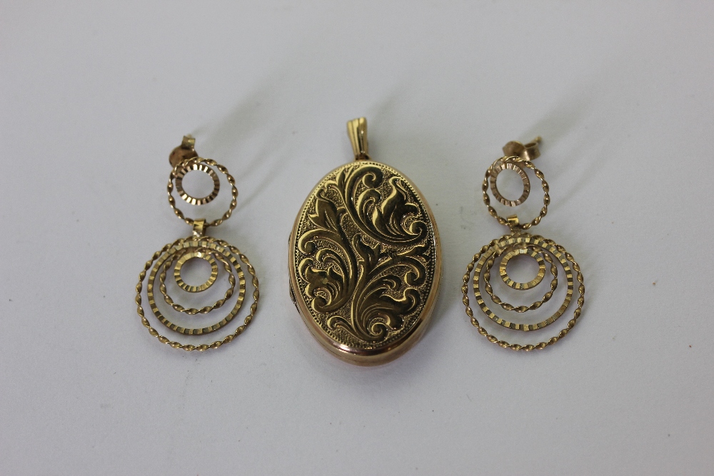 A 9ct gold oval locket, and a pair of 9ct gold drop earrings 9.6g