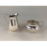 An Elizabeth II silver cream jug, maker Henry Clifford Davis, Birmingham 1961, together with a two