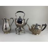 A Victorian silver plated ewer with greyhound finial, a silver plated kettle on stand with burner, a