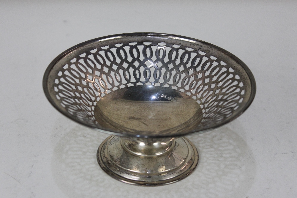 A modern silver circular bon bon dish with pierced border on pedestal base, maker Bishton's Ltd.